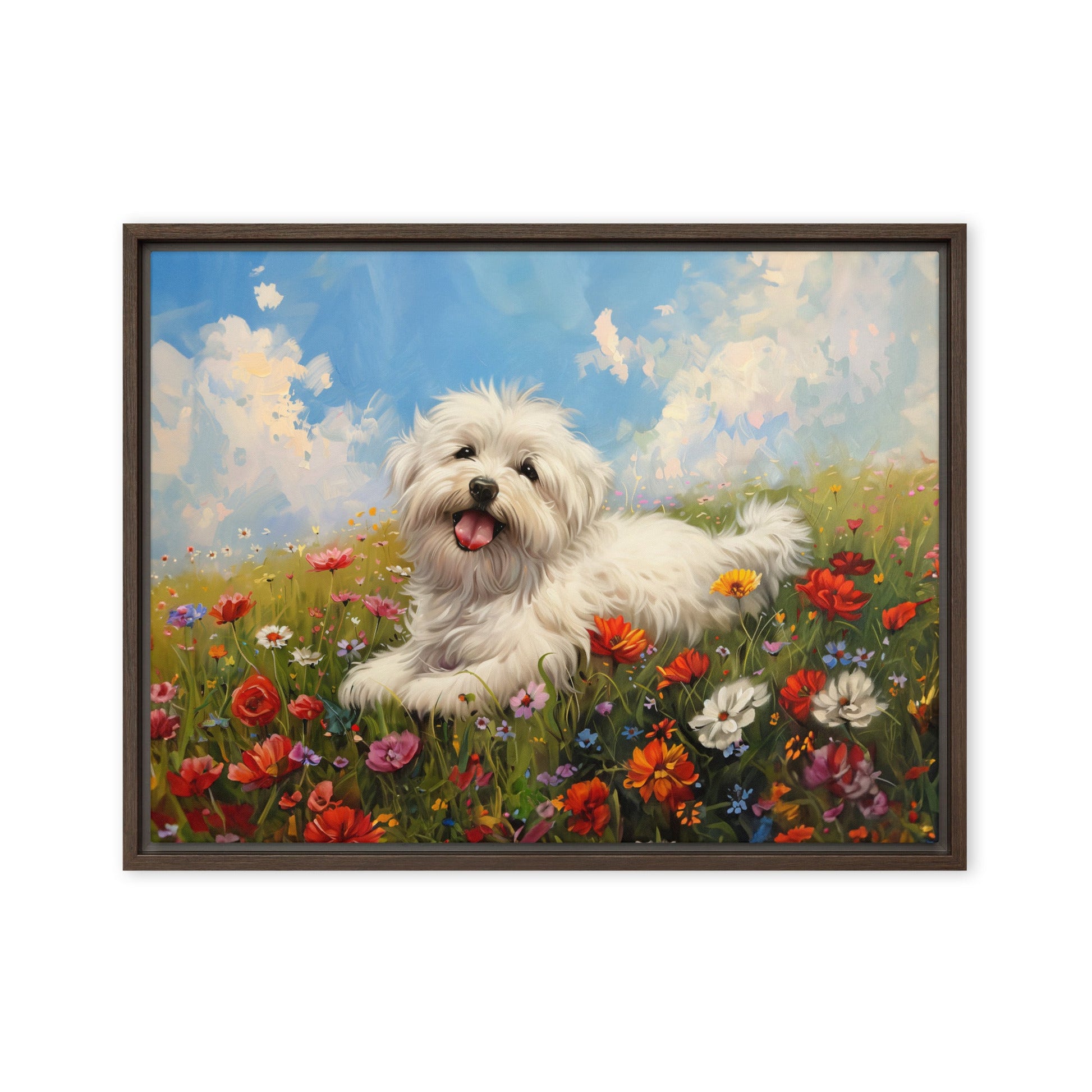 A happy coton de tulear sits on a grass hill with wildflowers.