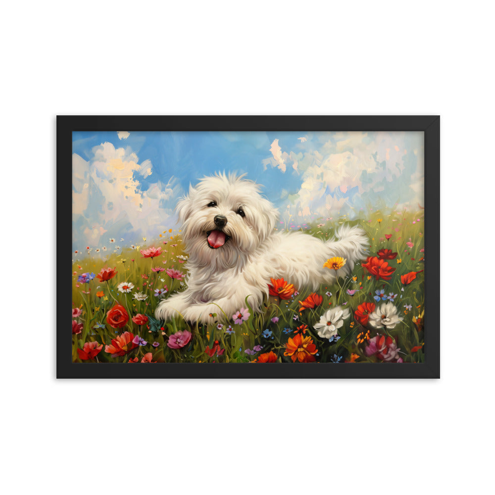 A happy coton de tulear sits on a grass hill with wildflowers.