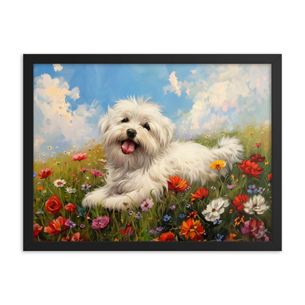 A happy coton de tulear sits on a grass hill with wildflowers.